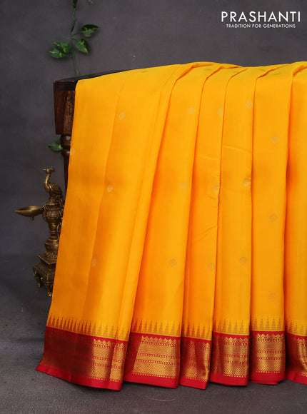 Pure kanchipuram silk saree mango yellow and red with zari woven buttas and temple design zari woven korvai border