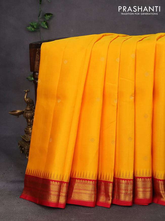 Pure kanchipuram silk saree mango yellow and red with zari woven buttas and temple design zari woven korvai border