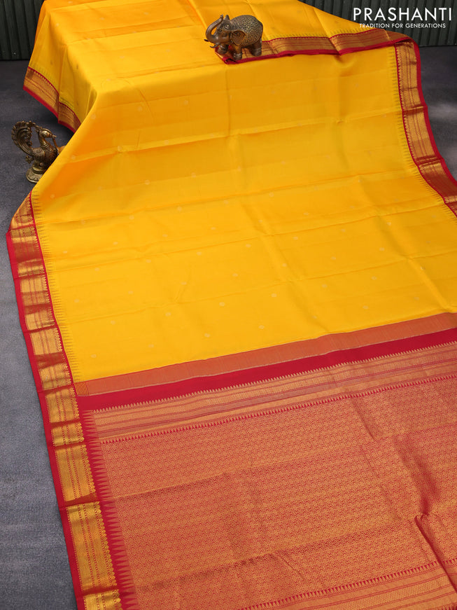 Pure kanchipuram silk saree mango yellow and red with zari woven buttas and temple design zari woven korvai border