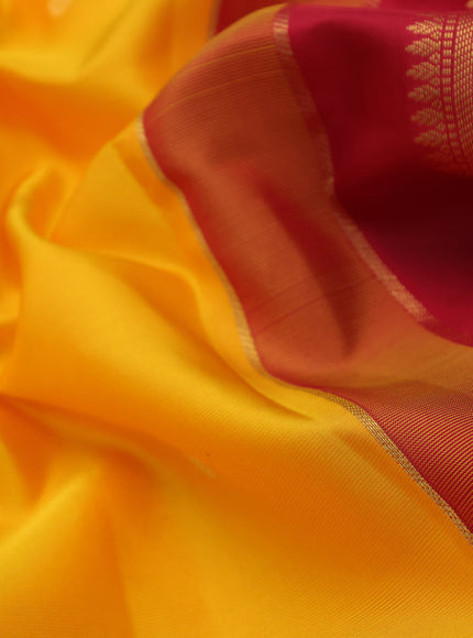 Pure kanchipuram silk saree mango yellow and red with zari woven buttas and temple design zari woven korvai border