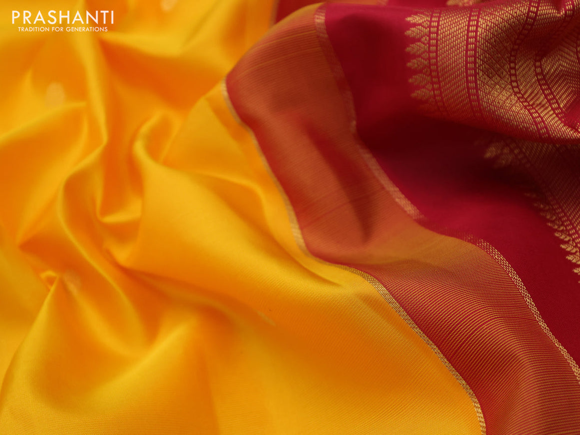 Pure kanchipuram silk saree mango yellow and red with zari woven buttas and temple design zari woven korvai border