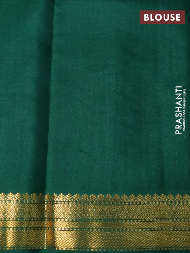 Pure kanchipuram silk saree magenta pink and green with zari woven buttas and temple design zari woven korvai border