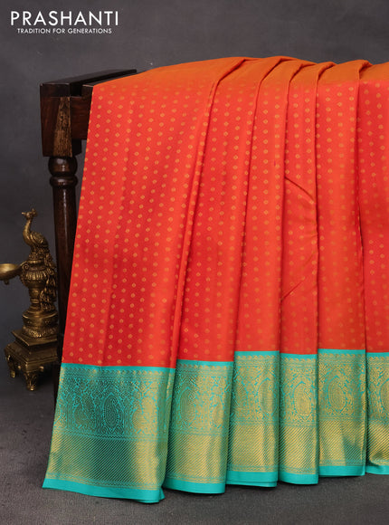 Pure kanchipuram silk saree dual shade of pinkish orange and teal blue with allover zari woven 1000 buttas and rich zari woven korvai border