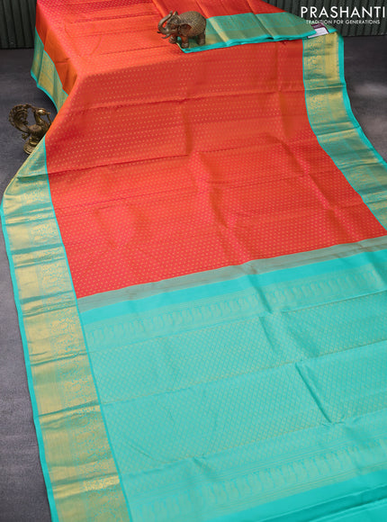 Pure kanchipuram silk saree dual shade of pinkish orange and teal blue with allover zari woven 1000 buttas and rich zari woven korvai border