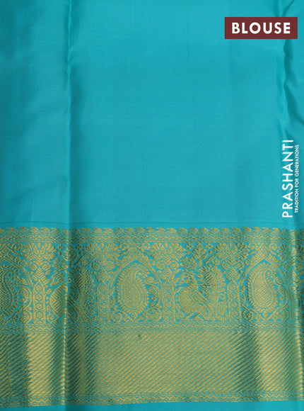 Pure kanchipuram silk saree dual shade of pinkish orange and teal blue with allover zari woven 1000 buttas and rich zari woven korvai border