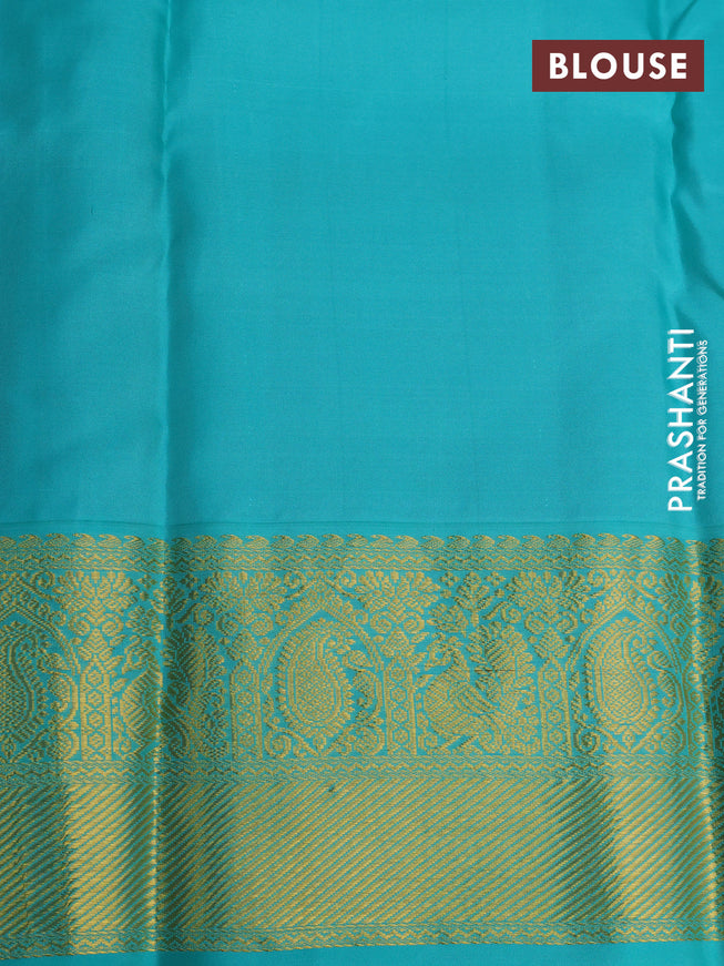 Pure kanchipuram silk saree dual shade of pinkish orange and teal blue with allover zari woven 1000 buttas and rich zari woven korvai border