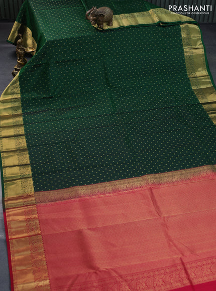 Pure kanchipuram silk saree bottle green and pink with allover self emboss & zari buttas and zari woven border