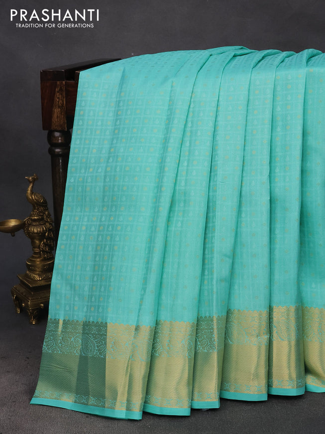 Pure kanchipuram silk saree teal blue and pink with allover self emboss & zari buttas and zari woven border