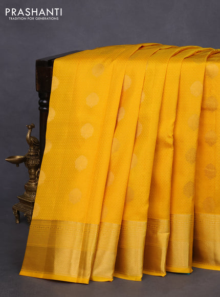 Pure kanchipuram silk saree mango yellow and teal green with allover self emboss & zari buttas and zari woven border