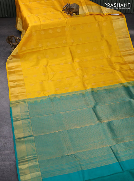 Pure kanchipuram silk saree mango yellow and teal green with allover self emboss & zari buttas and zari woven border