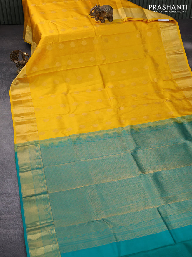 Pure kanchipuram silk saree mango yellow and teal green with allover self emboss & zari buttas and zari woven border