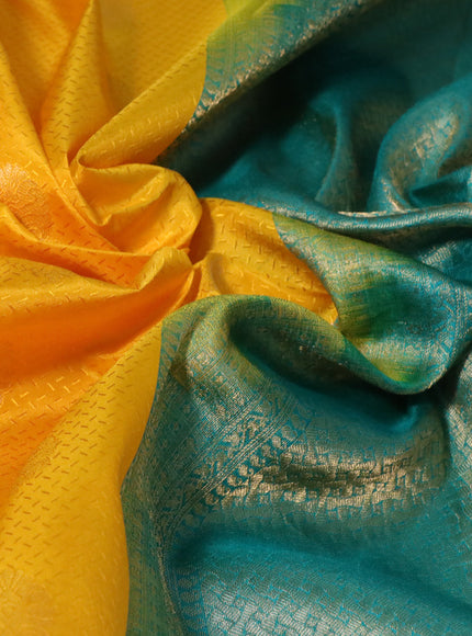 Pure kanchipuram silk saree mango yellow and teal green with allover self emboss & zari buttas and zari woven border