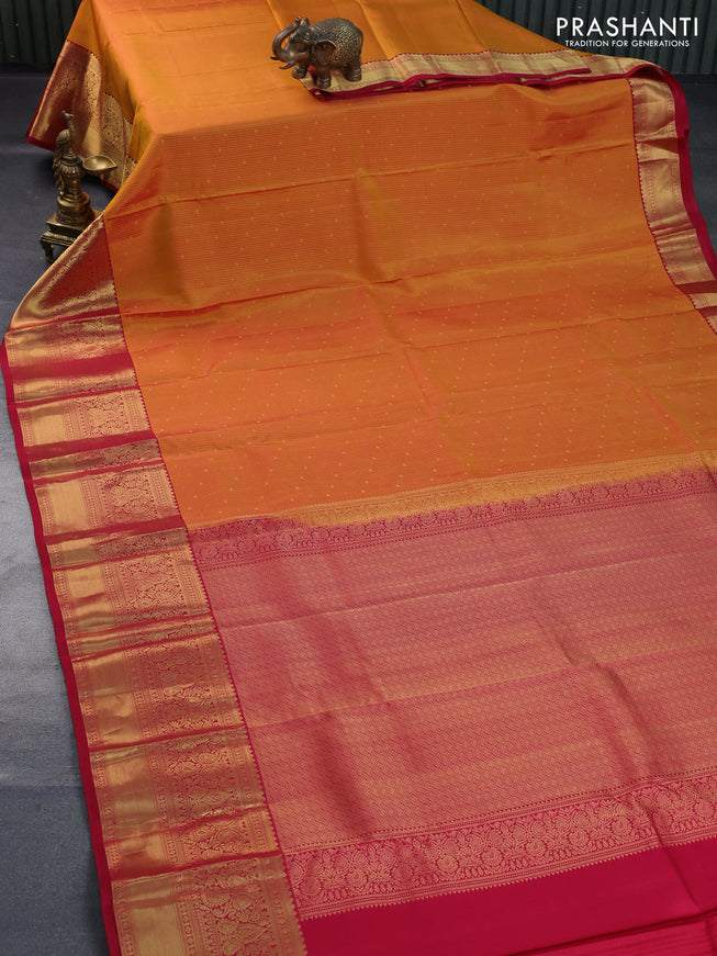 Pure kanchipuram silk saree dual shade of mustard and red with allover zari weaves and long zari woven border