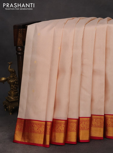 Pure kanchipuram silk saree cream and pink with allover self emboss & buttas and zari woven korvai border