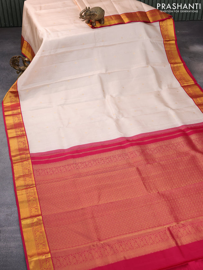 Pure kanchipuram silk saree cream and pink with allover self emboss & buttas and zari woven korvai border