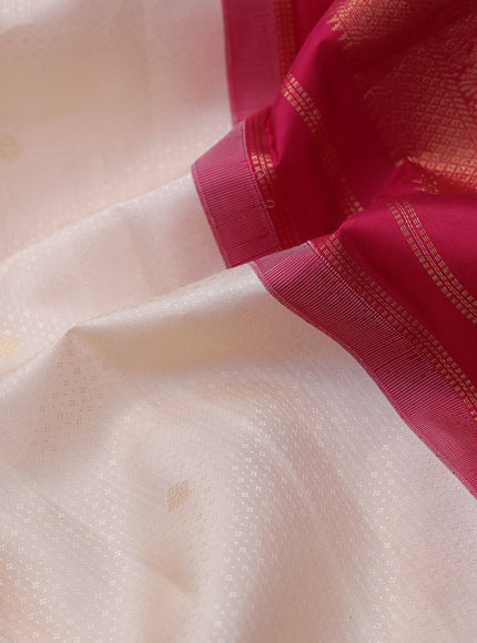 Pure kanchipuram silk saree cream and pink with allover self emboss & buttas and zari woven korvai border