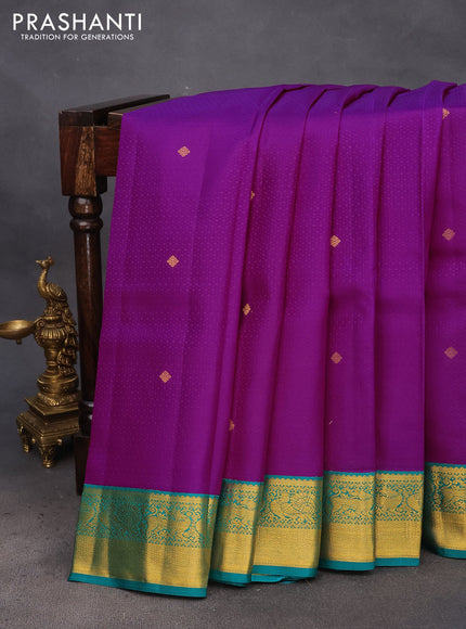 Pure kanchipuram silk saree purple and teal green with allover self emboss & buttas and zari woven korvai border