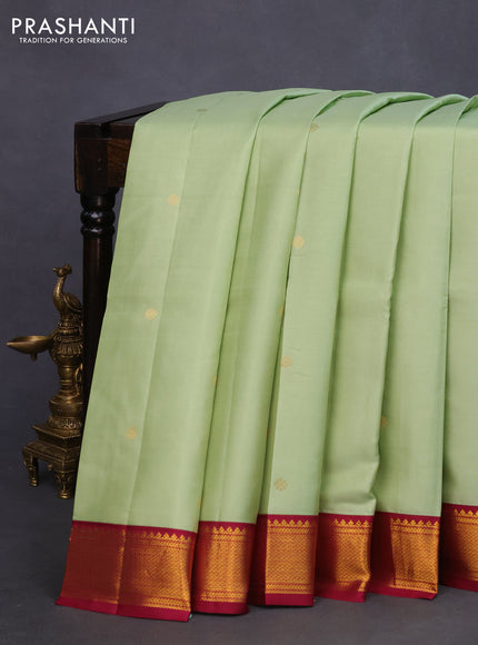 Pure kanchipuram silk saree pista green and magenta pink with zari woven buttas and zari woven korvai border