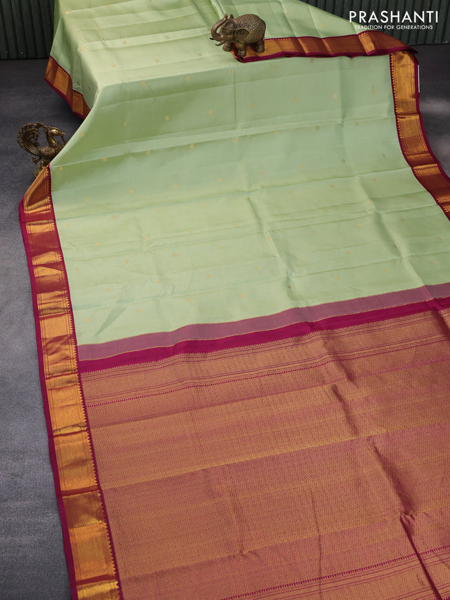 Pure kanchipuram silk saree pista green and magenta pink with zari woven buttas and zari woven korvai border