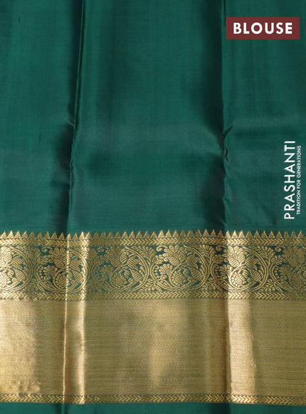 Pure kanchipuram silk saree dual shade of pinkish orange and green with zari woven buttas and long zari woven korvai border