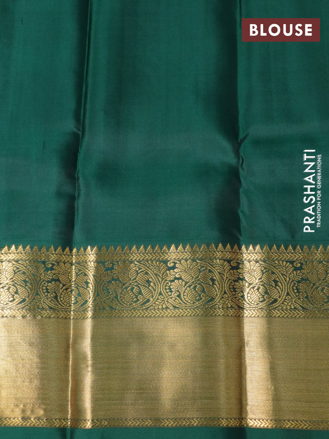 Pure kanchipuram silk saree dual shade of pinkish orange and green with zari woven buttas and long zari woven korvai border