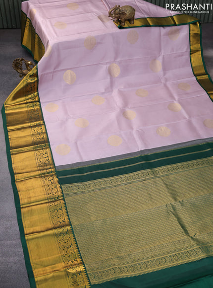 Pure kanchipuram silk saree pastel lavender shade and green with zari woven buttas and long zari woven korvai border