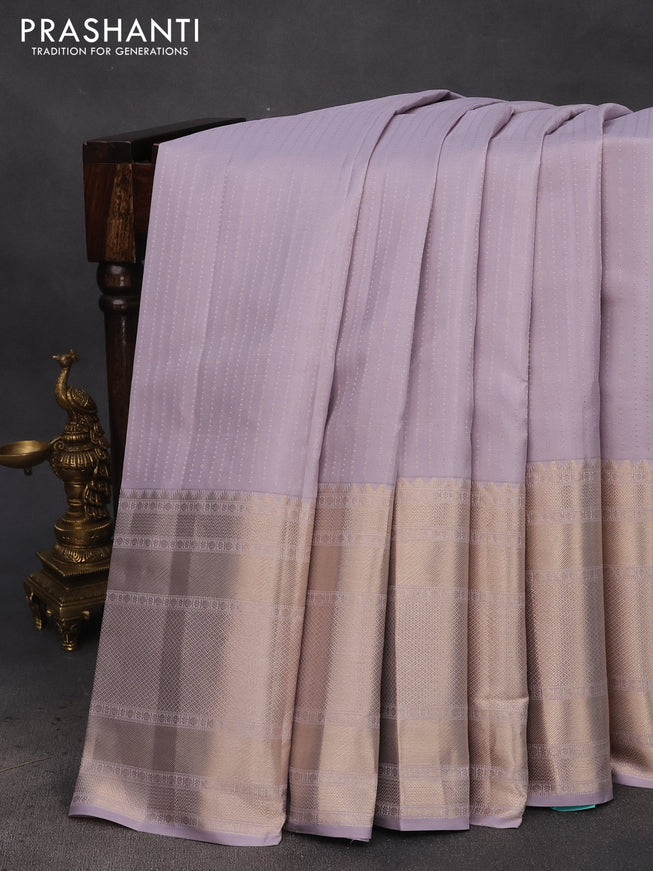 Pure kanchipuram silk saree pastel lavender shade and teal green with allover zari weaves and long zari woven border