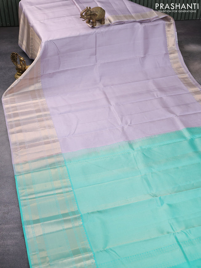 Pure kanchipuram silk saree pastel lavender shade and teal green with allover zari weaves and long zari woven border