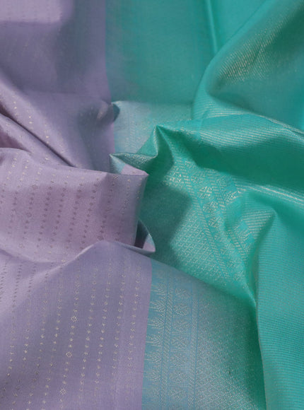 Pure kanchipuram silk saree pastel lavender shade and teal green with allover zari weaves and long zari woven border