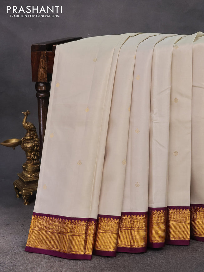 Pure kanchipuram silk saree off white and deep purple with zari woven buttas and zari woven korvai border