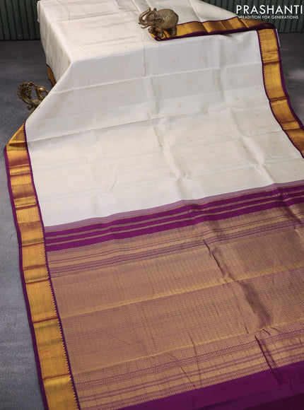 Pure kanchipuram silk saree off white and deep purple with zari woven buttas and zari woven korvai border