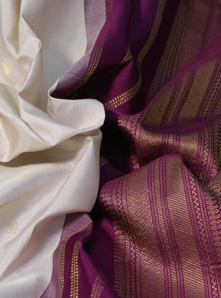 Pure kanchipuram silk saree off white and deep purple with zari woven buttas and zari woven korvai border