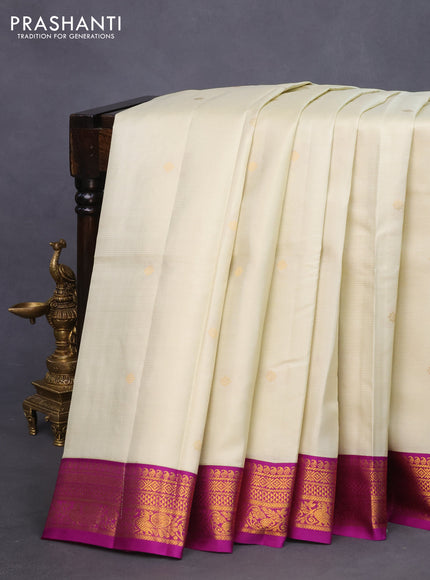 Pure kanchipuram silk saree cream and purple with allover zari weaves & buttas and zari woven korvai border