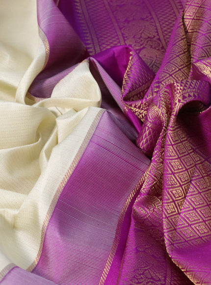 Pure kanchipuram silk saree cream and purple with allover zari weaves & buttas and zari woven korvai border