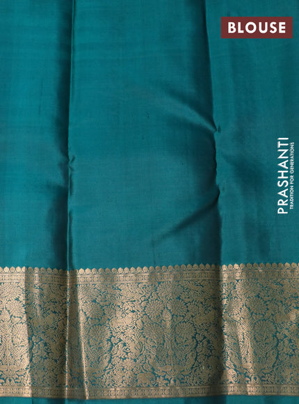 Pure kanchipuram silk saree black and green with allover zari weaves and zari woven border