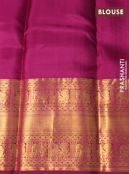 Pure kanchipuram silk saree blue and magenta pink with allover zari weaves and long zari woven korvai border