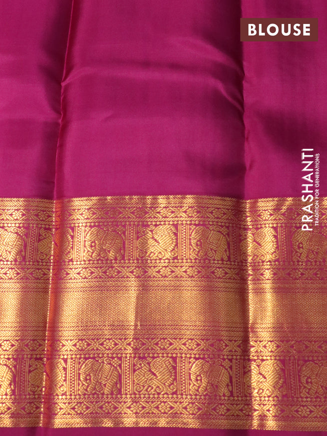 Pure kanchipuram silk saree blue and magenta pink with allover zari weaves and long zari woven korvai border