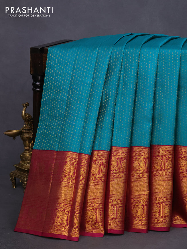 Pure kanchipuram silk saree teal green and magenta pink with allover zari weaves and long zari woven korvai border