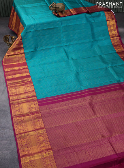 Pure kanchipuram silk saree teal green and magenta pink with allover zari weaves and long zari woven korvai border