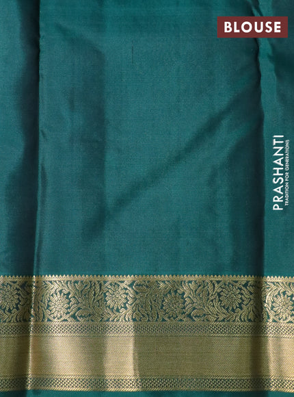 Pure kanchipuram silk saree black and dark green with allover zari strips & buttas and zari woven border