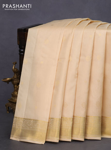 Pure kanchipuram silk saree cream and pink with allover zari strips & buttas and zari woven border