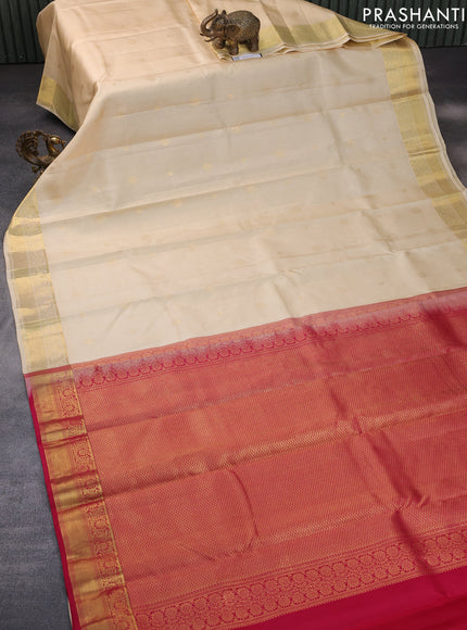 Pure kanchipuram silk saree cream and pink with allover zari strips & buttas and zari woven border