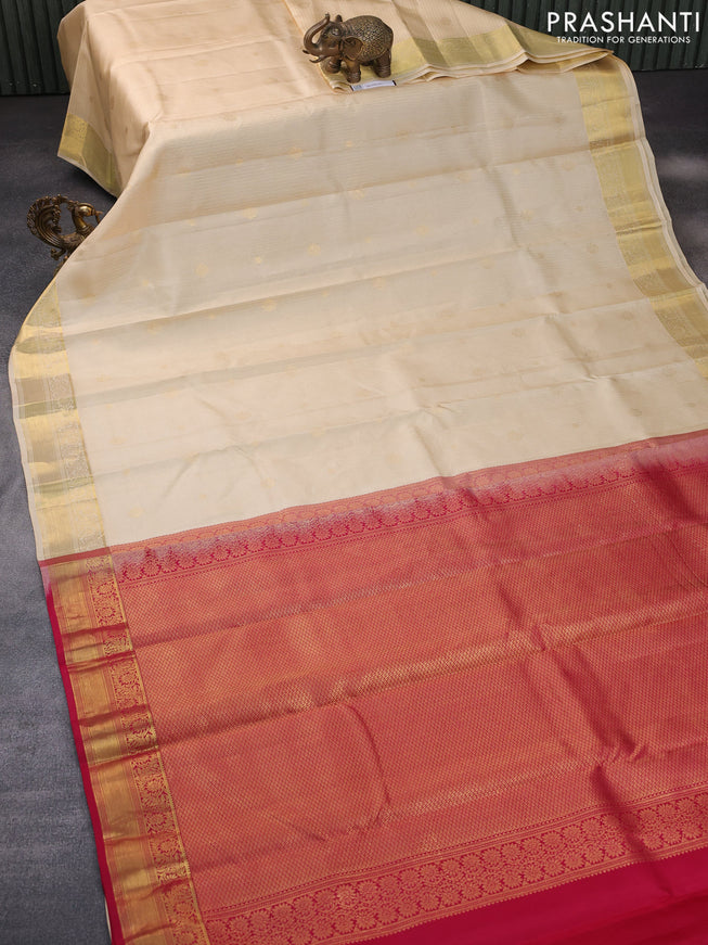 Pure kanchipuram silk saree cream and pink with allover zari strips & buttas and zari woven border