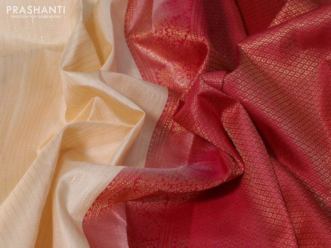 Pure kanchipuram silk saree cream and pink with allover zari strips & buttas and zari woven border