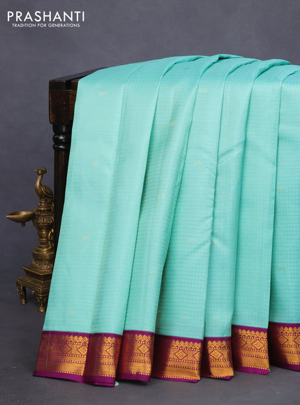 Pure kanchipuram silk saree teal blue and purple with allover zari checks & buttas and zari woven korvai border