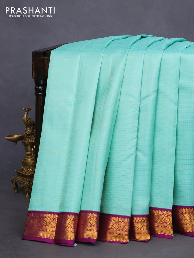 Pure kanchipuram silk saree teal blue and purple with allover zari checks & buttas and zari woven korvai border