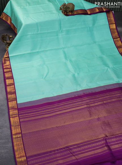 Pure kanchipuram silk saree teal blue and purple with allover zari checks & buttas and zari woven korvai border