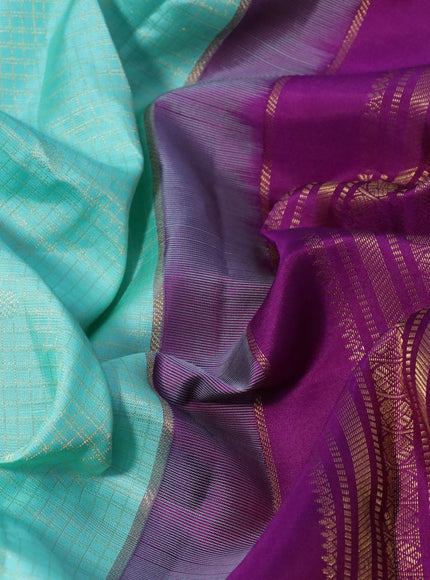 Pure kanchipuram silk saree teal blue and purple with allover zari checks & buttas and zari woven korvai border