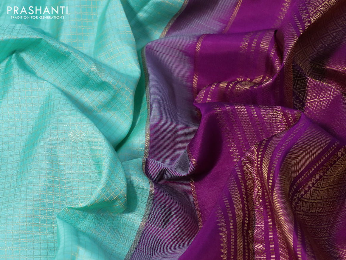 Pure kanchipuram silk saree teal blue and purple with allover zari checks & buttas and zari woven korvai border