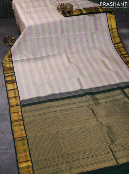 Pure kanchipuram silk saree pastel gree mauve pink and bottle green with allover zari stripe pattern and zari woven korvai border